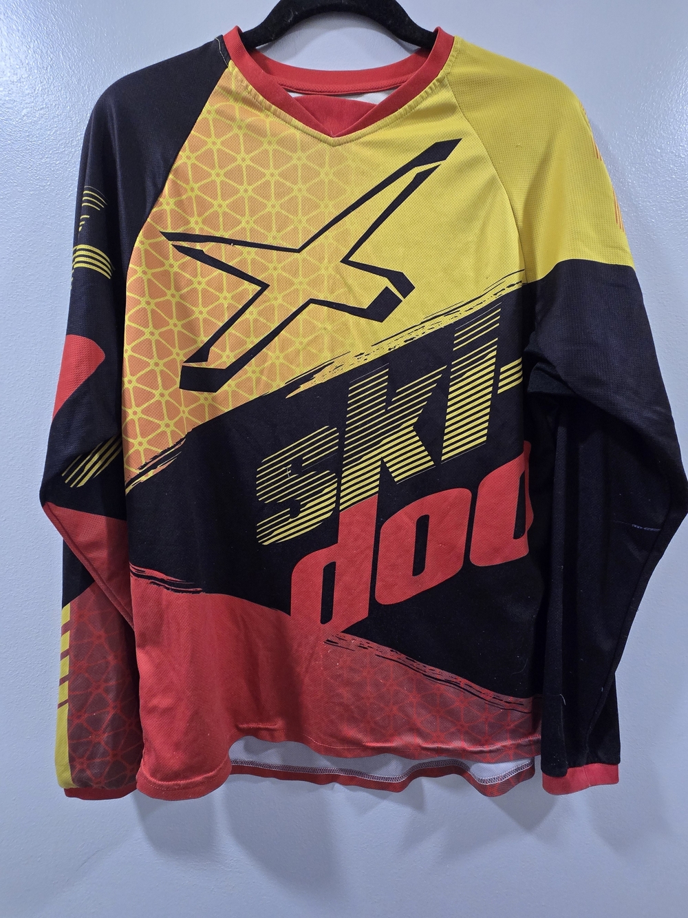Vintage Ski-Doo X-Team long-sleeve racing jersey featuring a vibrant red, yellow